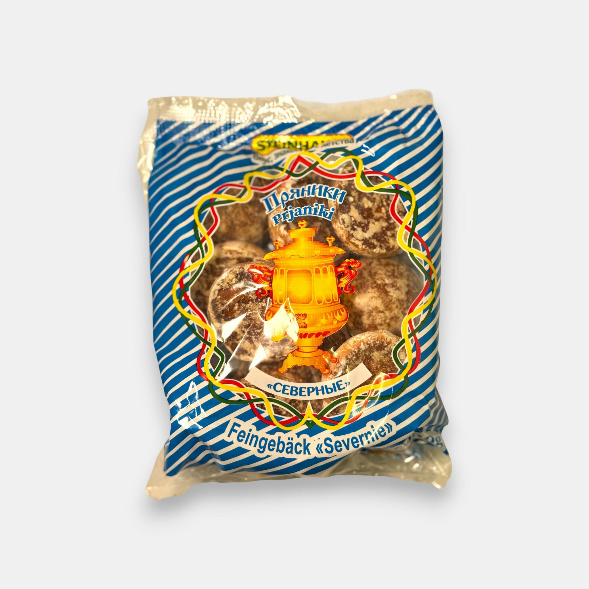 Sachet de pryaniki “Severnie” Steinhauer, pains d’épices traditionnels du Nord en emballage bleu décoré, disponible chez Pomo.bio, épicerie slave à Paris.