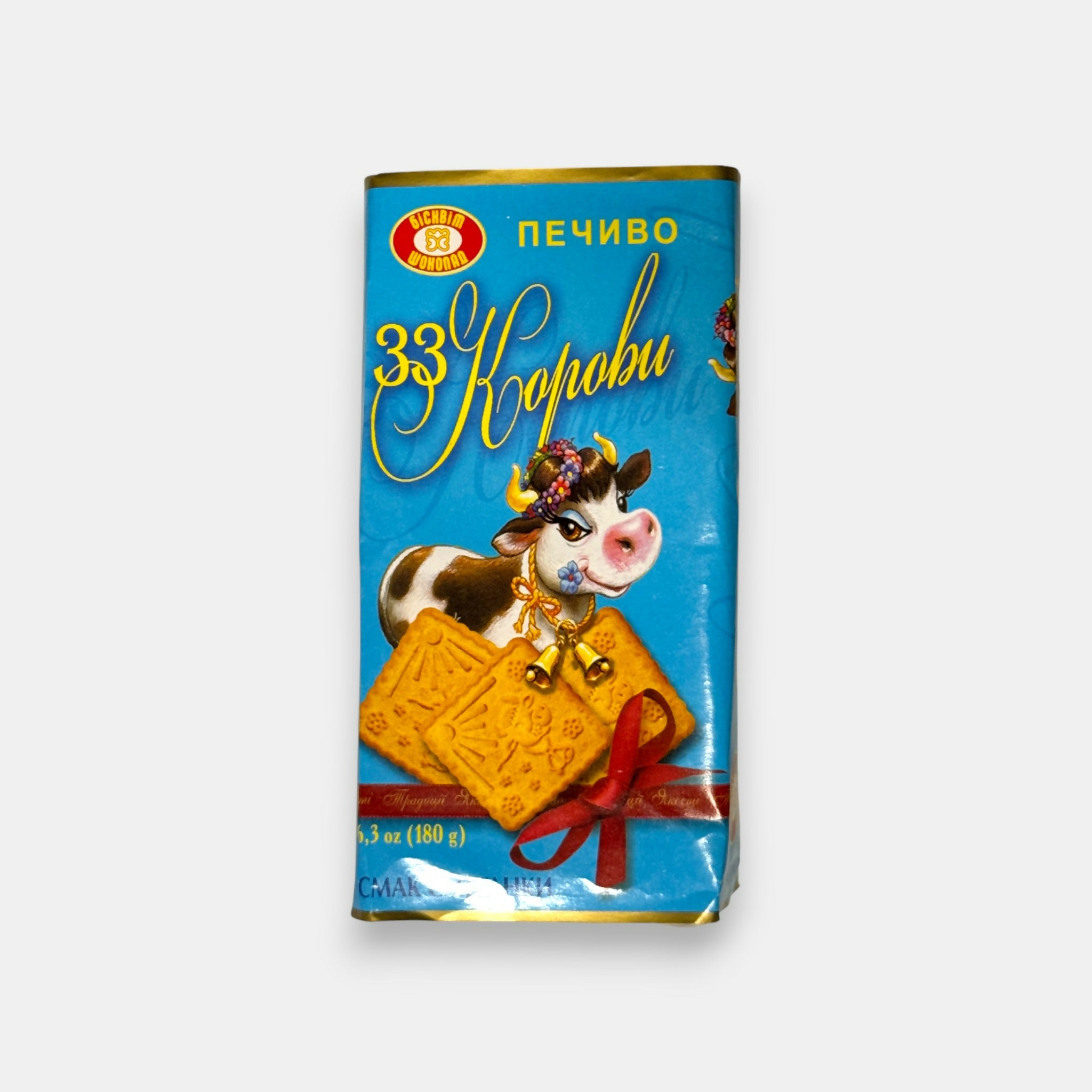 Vue de face d’un paquet de biscuits au goût lacté doux, illustré d’une vache, gourmandise d’épicerie slave Pomo.bio avec livraison rapide à Paris.