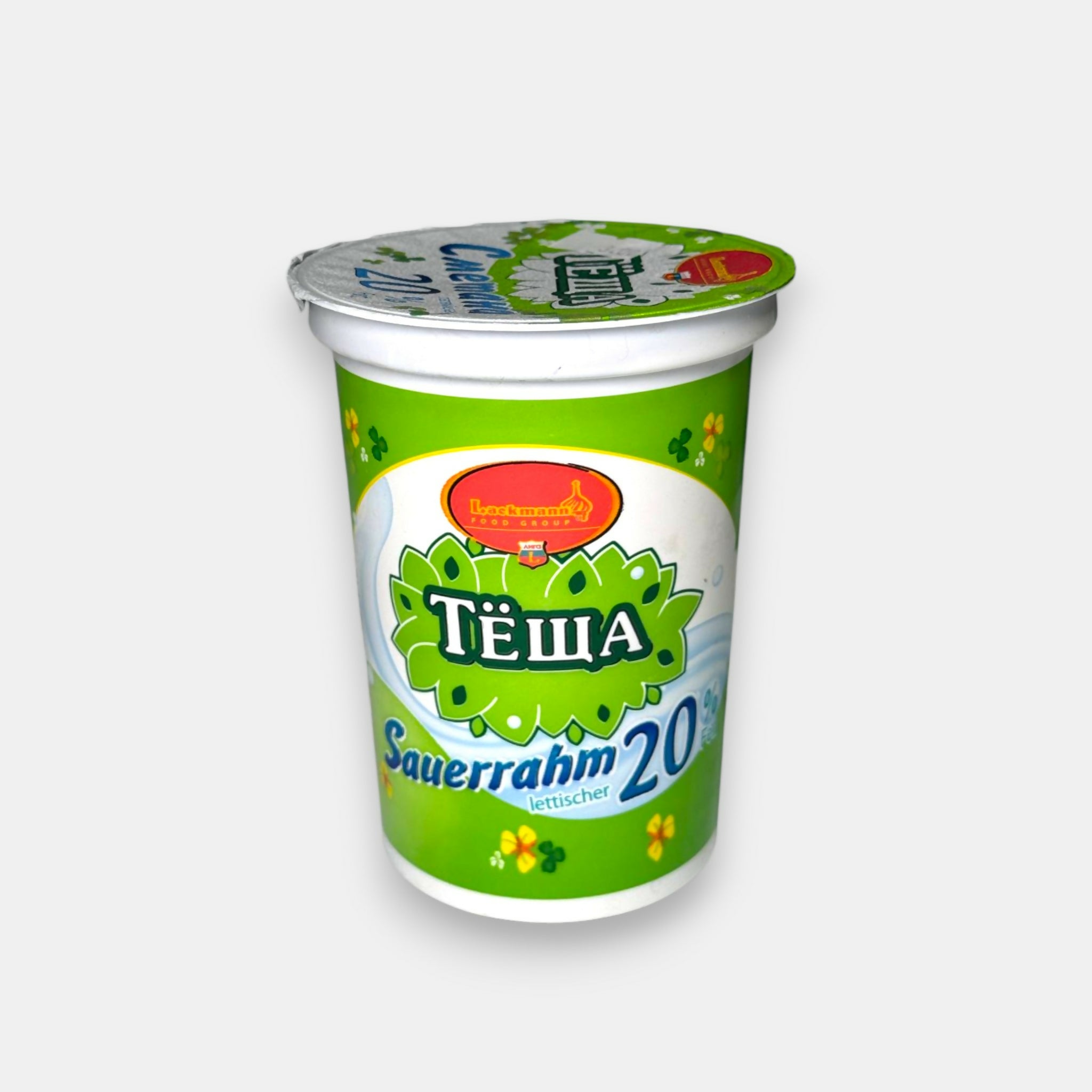 Crème aigre 20 % Tiochtcha en pot, emballage vu de face, crème épaisse légèrement acidulée pour soupes et plats chauds, épicerie slave Pomo.bio à Paris, livraison rapide à Paris