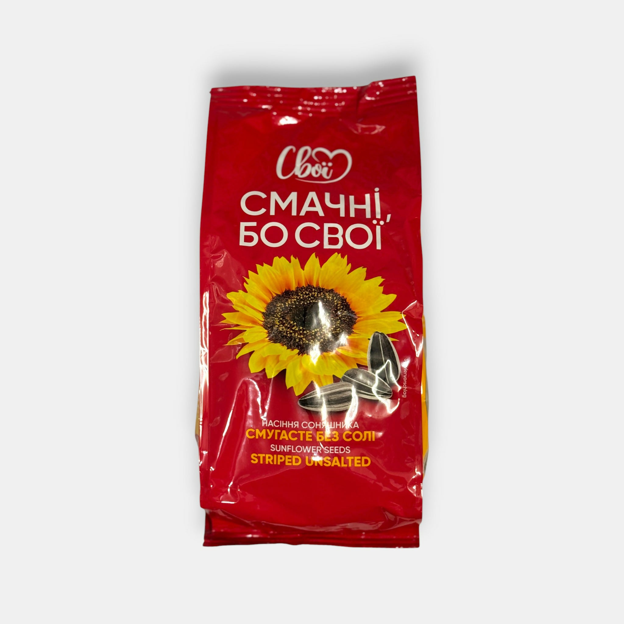 Sachet rouge de graines de tournesol striées au goût intense, vue de face, snack d’épicerie slave à Paris — livraison rapide Pomo.bio.