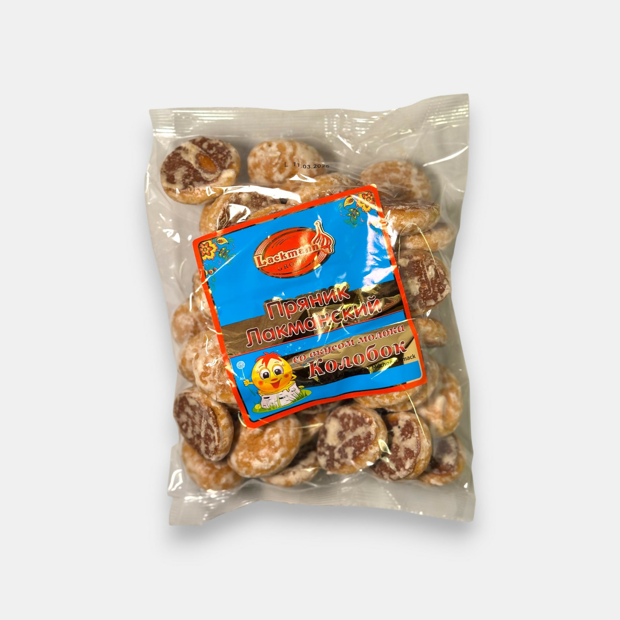 Sachet de pryaniki “Lakmannski” lait Lackmann, pains d’épices au goût crémeux en emballage transparent, disponible chez Pomo.bio, épicerie slave à Paris.