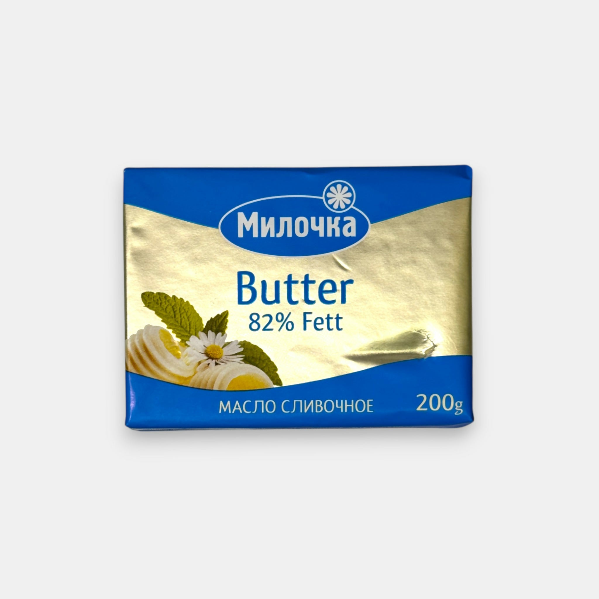 Plaquette de beurre doux «Milochka» 82,5 %, 200 g — beurre naturel au goût riche et crémeux, idéal pour la cuisson, la pâtisserie ou les tartines. Disponible sur Pomo.bio.