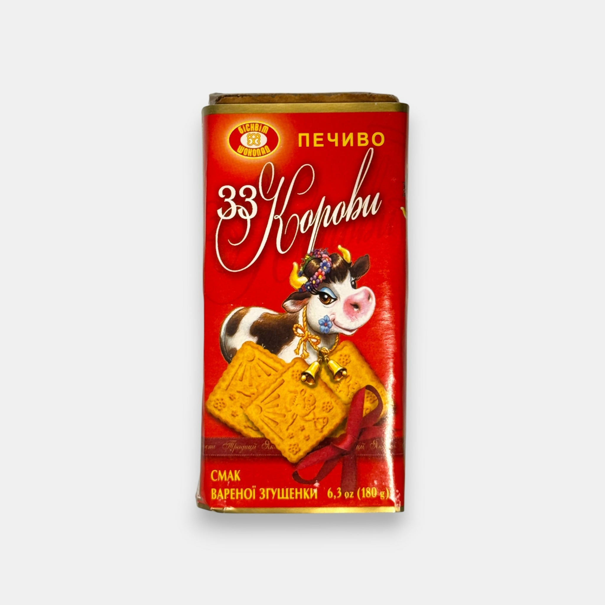 Vue de face d’un paquet de biscuits sablés fourrés à la crème goût lait concentré cuit « 33 Korovy », 180 g, épicerie slave Pomo.bio avec livraison rapide à Paris.