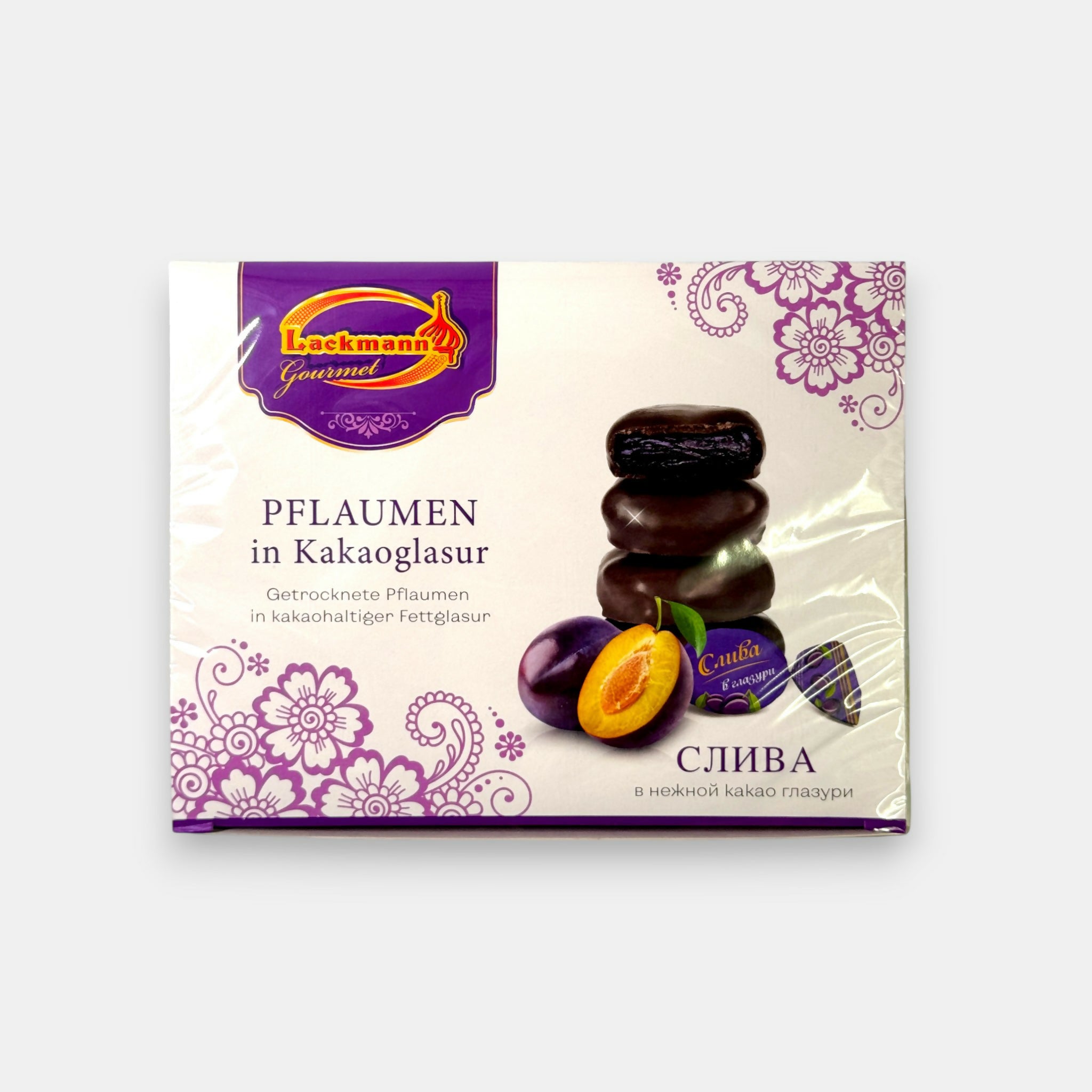 Boîte de prunes enrobées de cacao « Lackmann », fruits moelleux couverts de chocolat, disponible dans l’épicerie slave Pomo.bio à Paris.