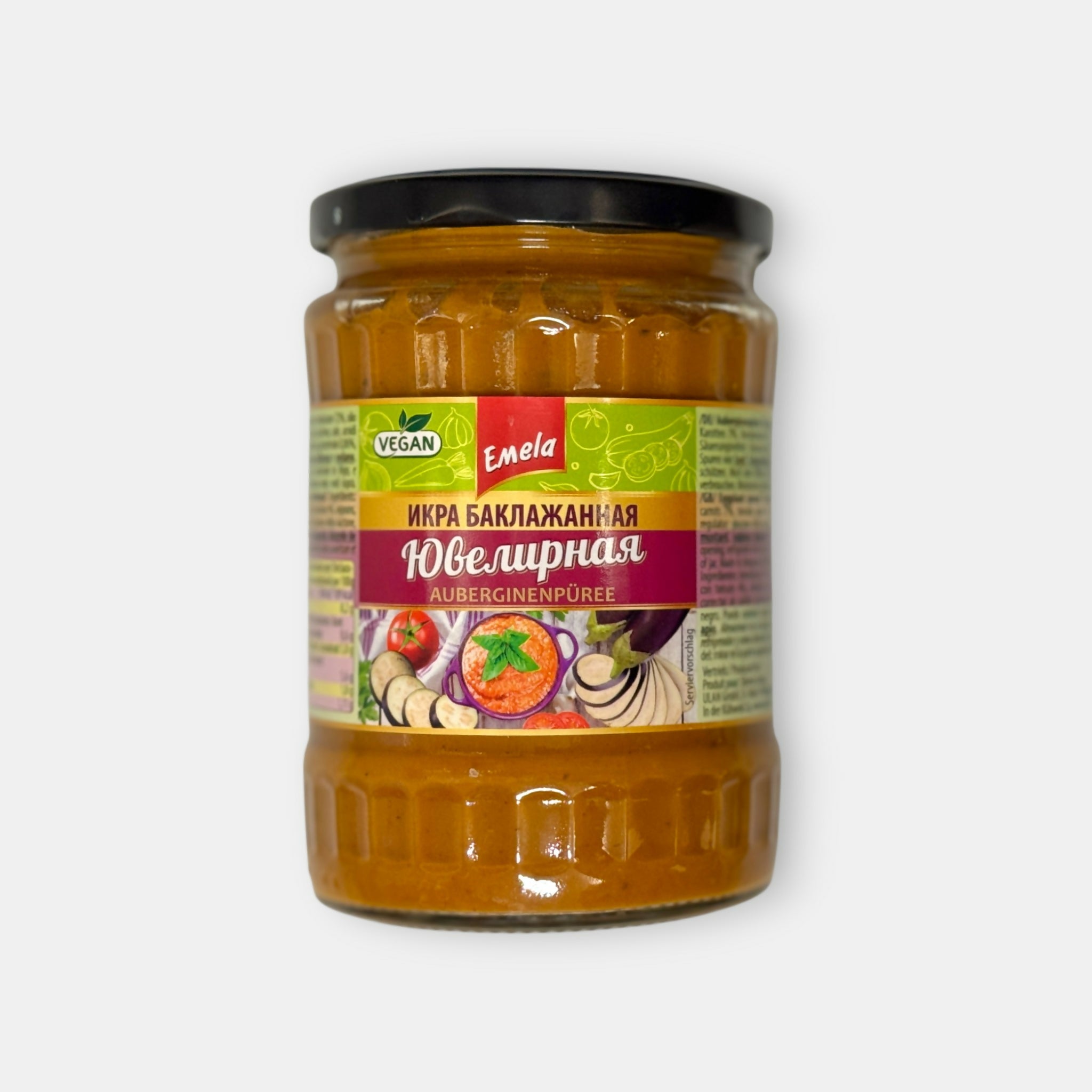 Vue de face d’un bocal de purée d’aubergine, 540 g, avec étiquette illustrée, produit typique d’épicerie slave Pomo.bio, livraison rapide à Paris.